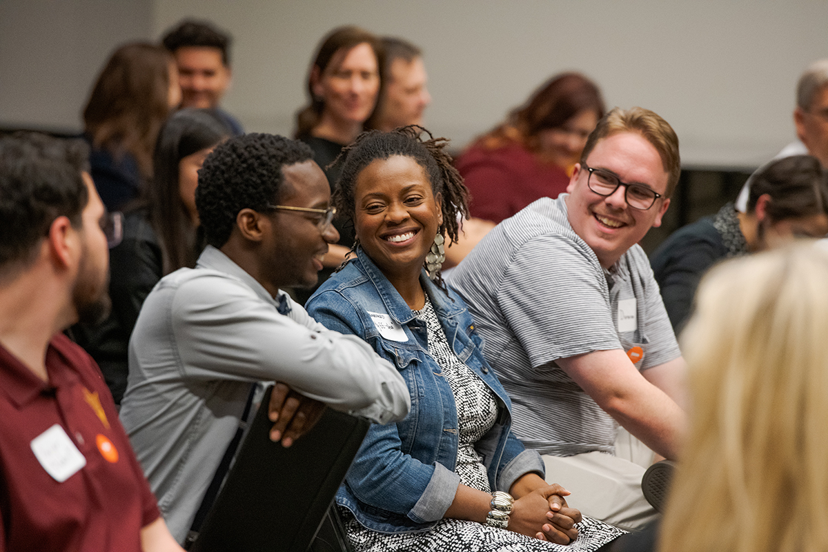 asu-professionals-students-further-education-class-auditorium-man-woman-smiling