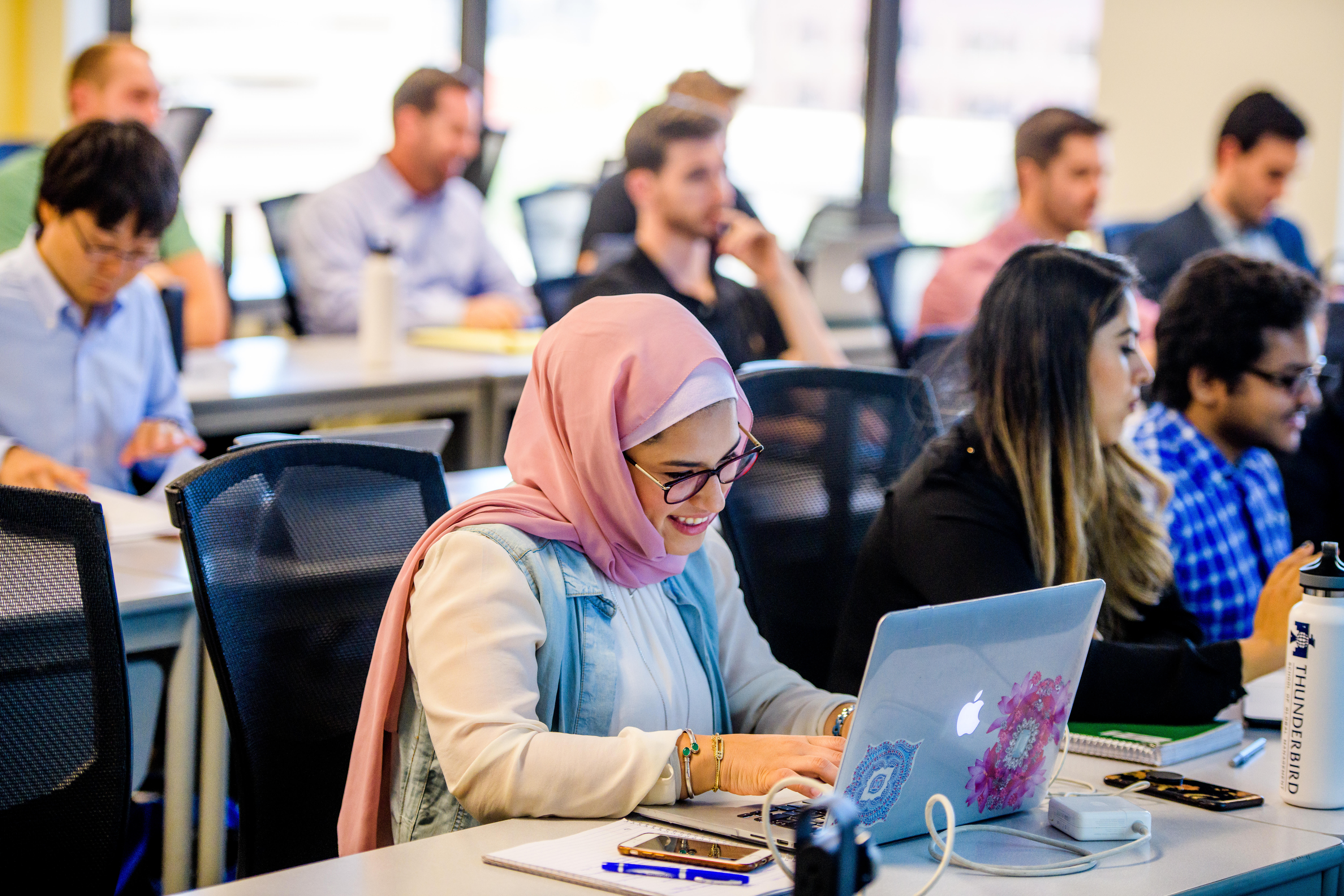 female-student-laptop-in-classroom